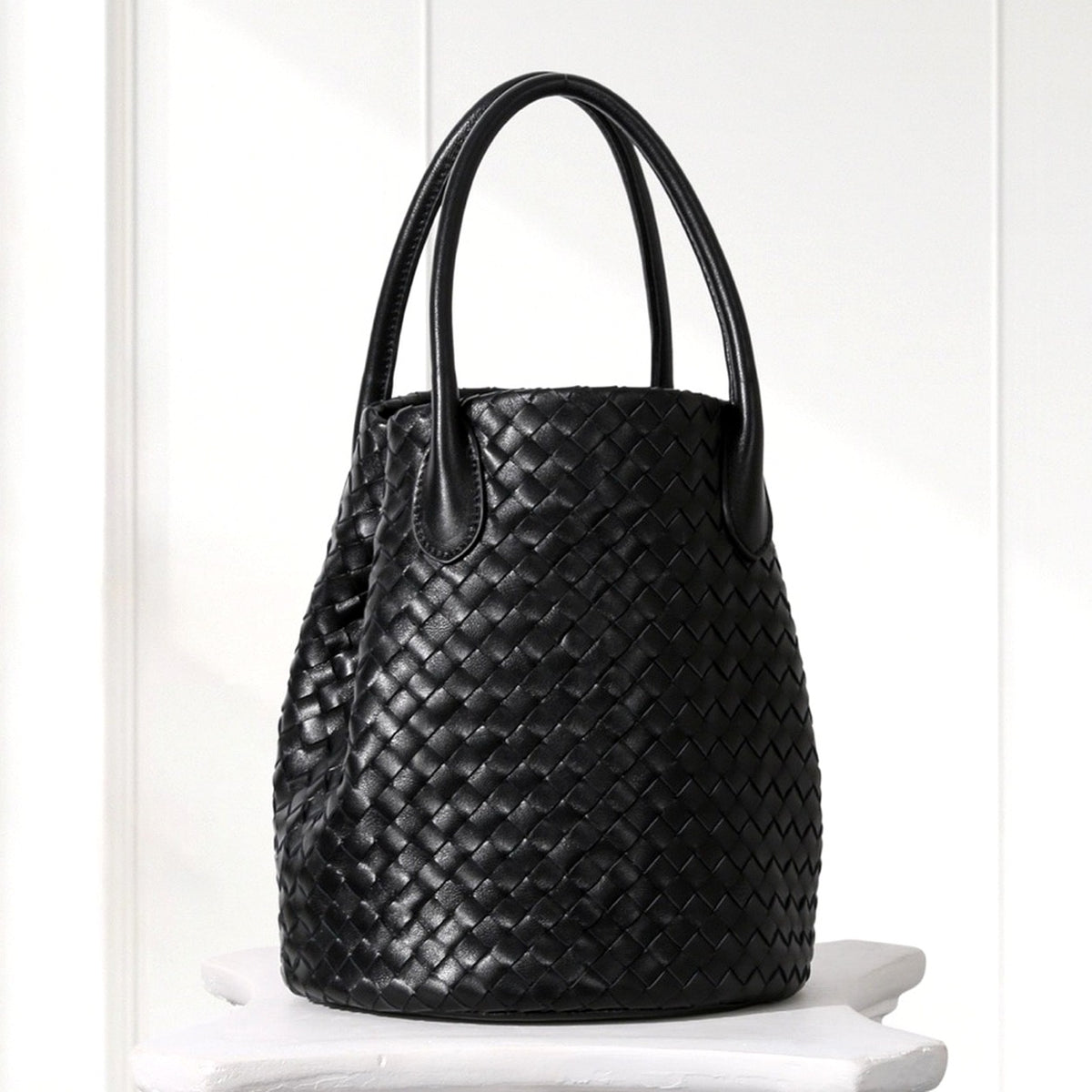 Ingrid Woven Bucket Bag in Black, angled view