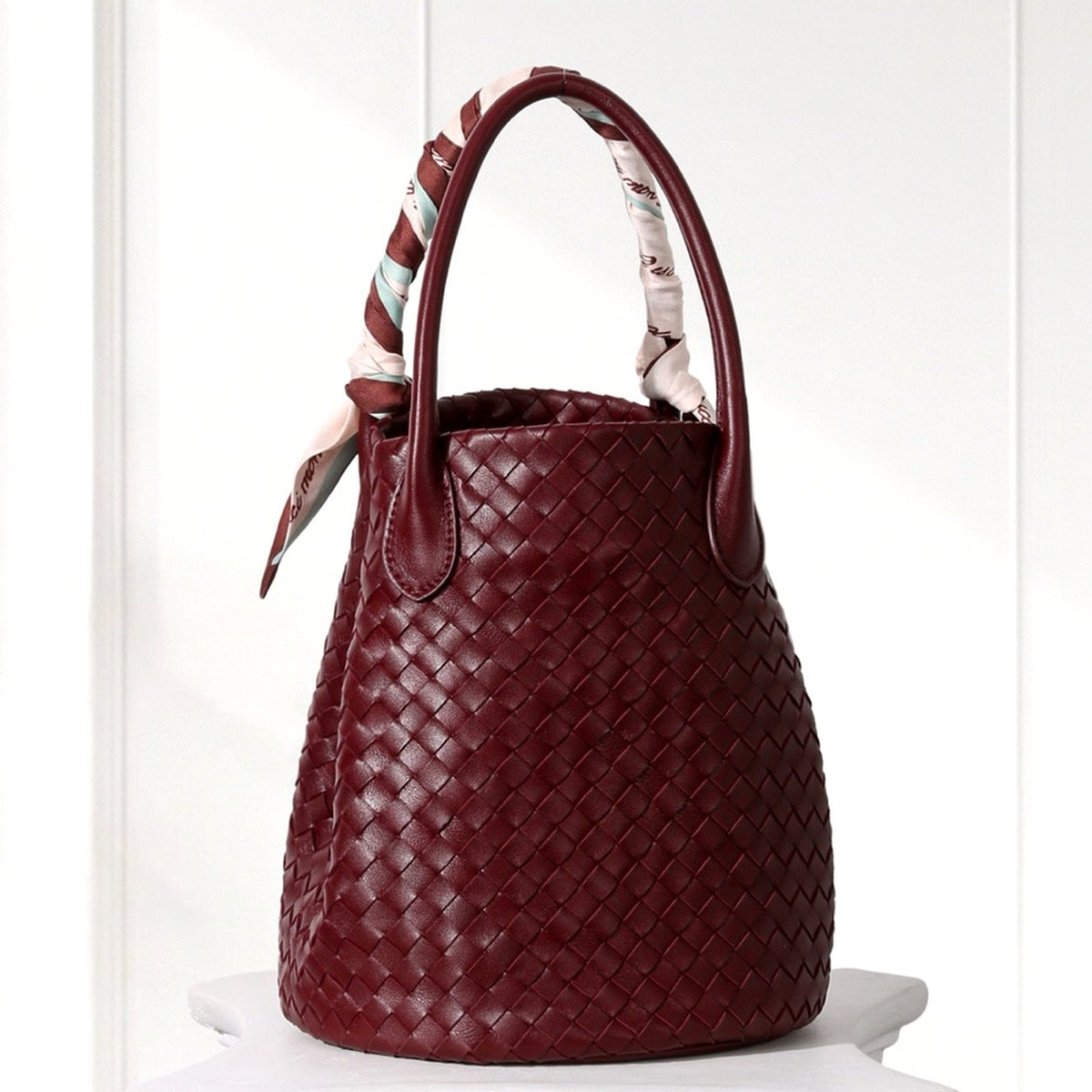 Ingrid Woven Bucket Bag in Burgundy, angled view