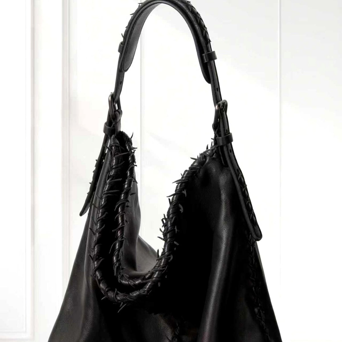 Eira Woven Hobo Bag in Black, leather detail