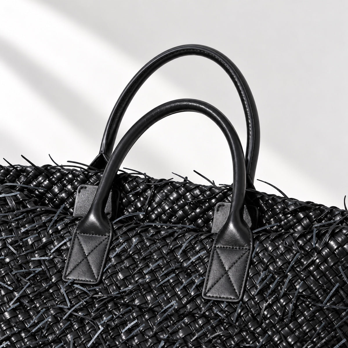 Astrid Fringed Tote in Black, handle and weave detail