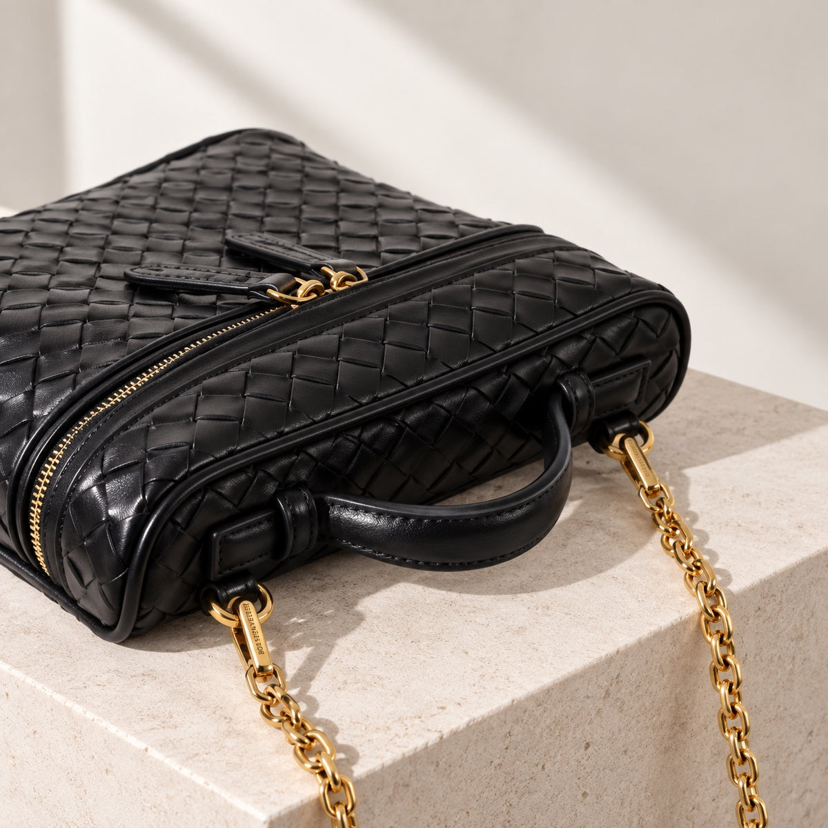 Vera Vanity Bag in Black, woven leather and chain detail