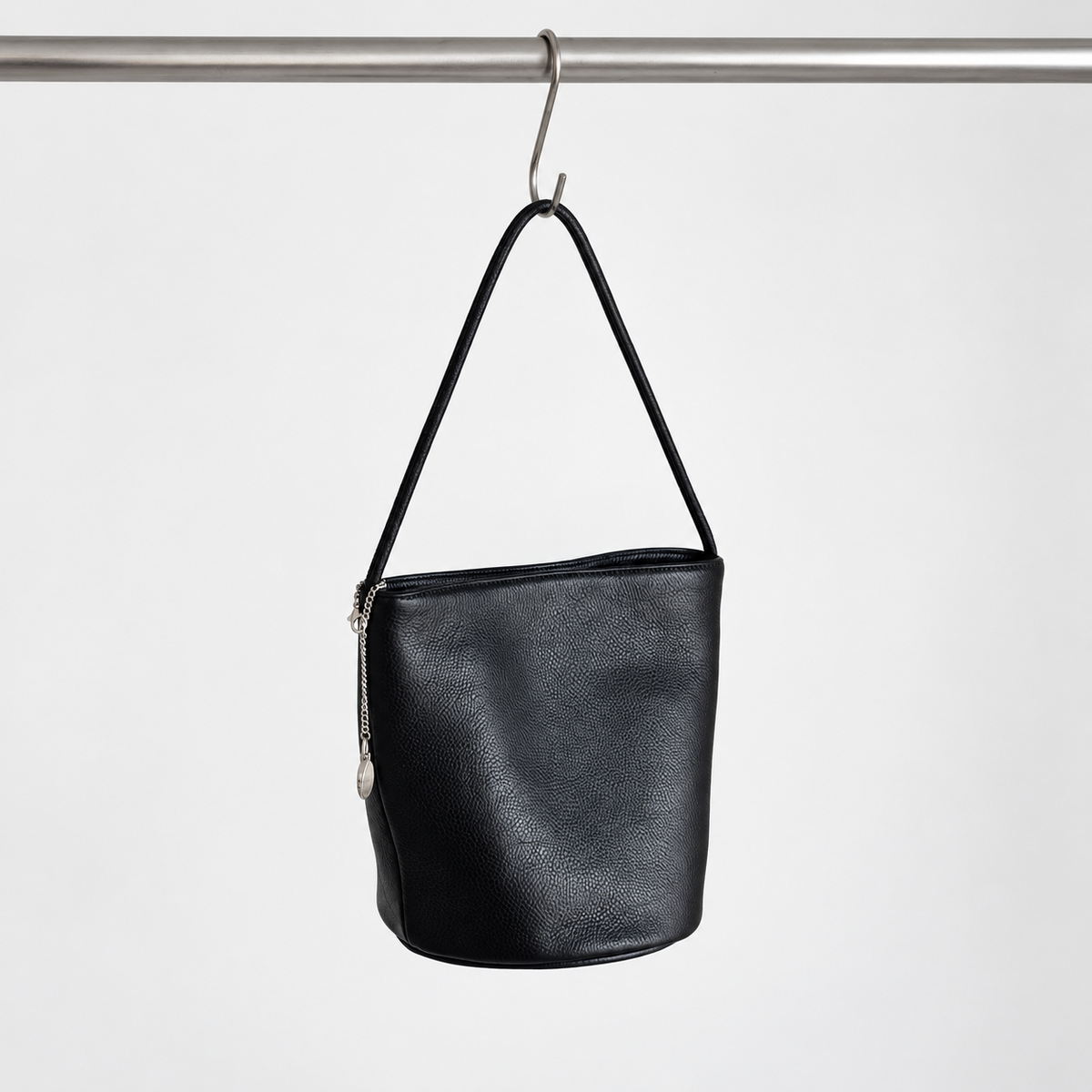 Cleo Smooth Bucket Bag in Black, hanging view