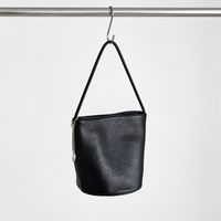 Cleo Smooth Bucket Bag in Black, hanging view