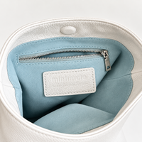 Cleo Smooth Bucket Bag in Ivory, interior pocket and lining detail