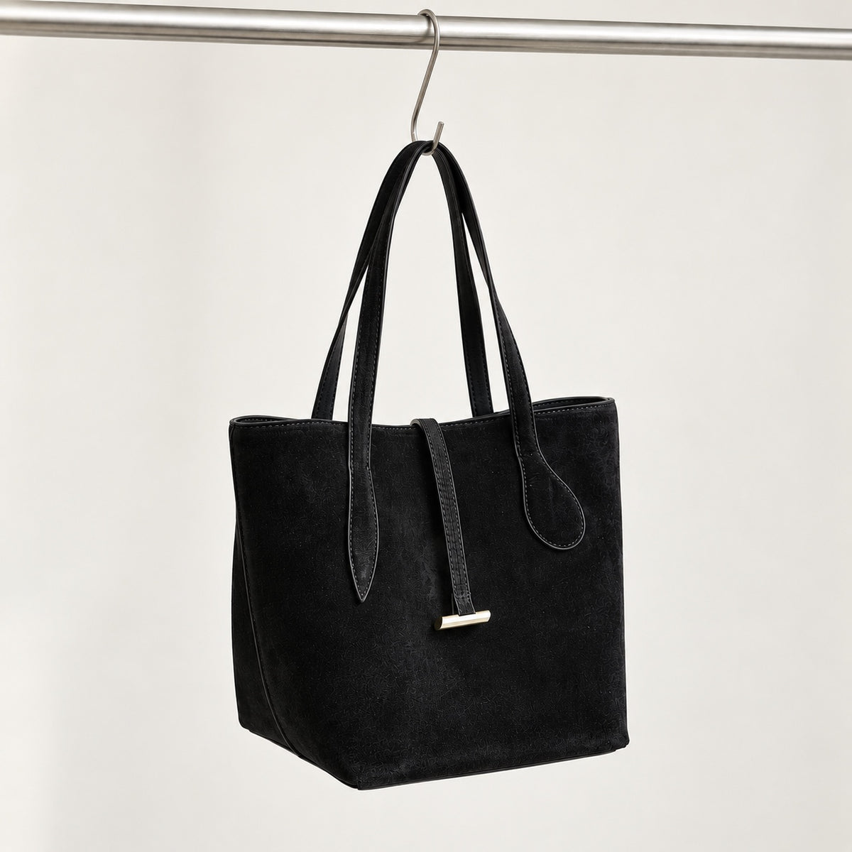 Selma Compact Tote in Black, hanging three-quarter view