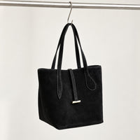 Selma Compact Tote in Black, hanging three-quarter view