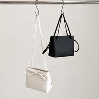 Mila Shoulder Bag in Black and Ivory, hanging together