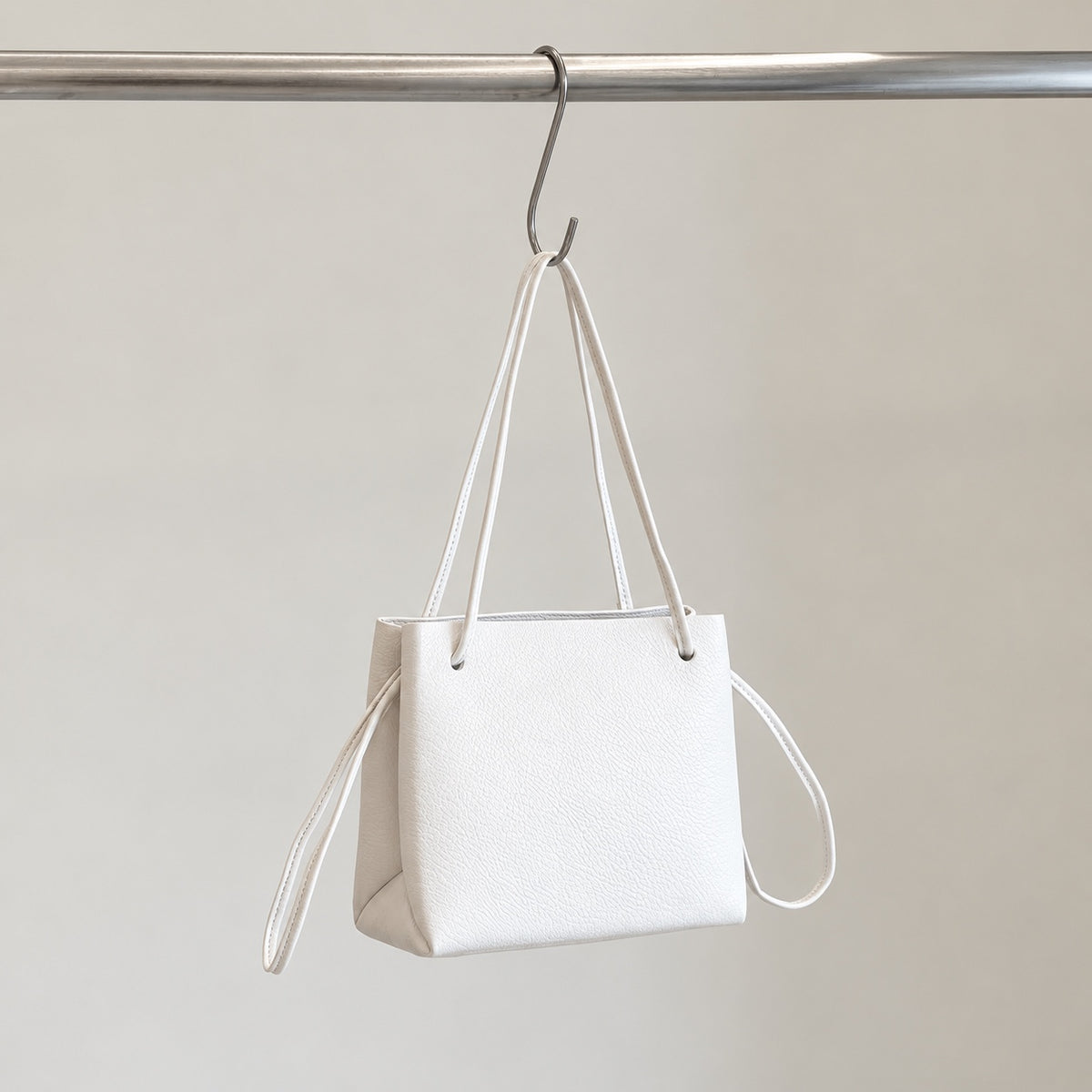 Mila Shoulder Bag in Ivory, angled view