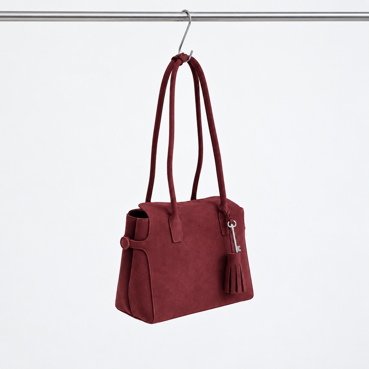 Freya Tassel Shoulder Bag in Deep Brown, angled hanging view