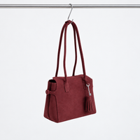 Freya Tassel Shoulder Bag in Deep Brown, angled hanging view