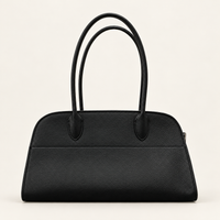 Veda East West Tote in Black, front view of the pebbled top-grain cowhide bag with long handles