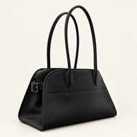 Veda East West Tote, Black three-quarter view, showing long handles and side buckle