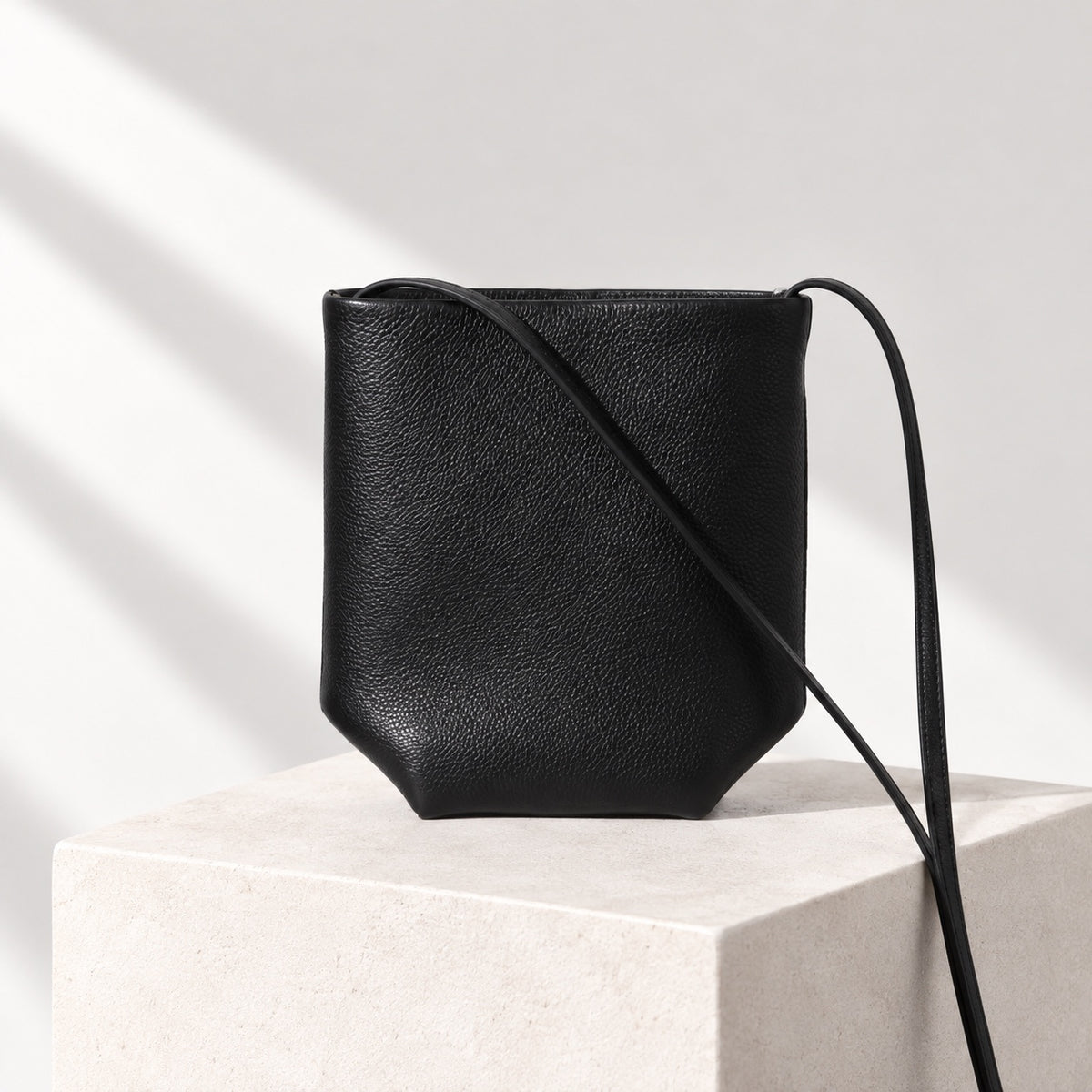 Asta Mini Bucket Bag in Black, front view
