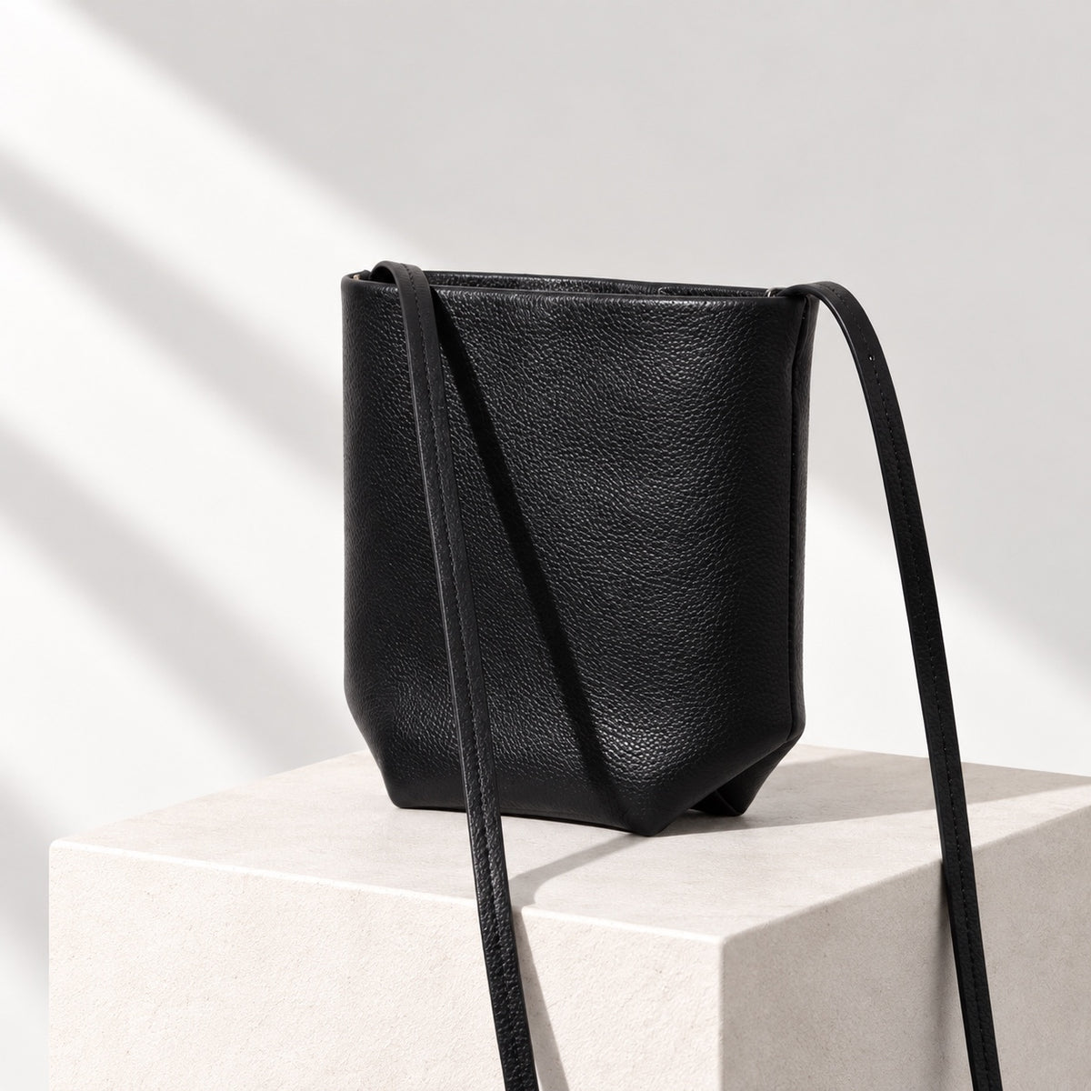 Asta Mini Bucket Bag in Black, angled view