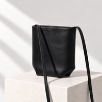 Asta Mini Bucket Bag in Black, angled view