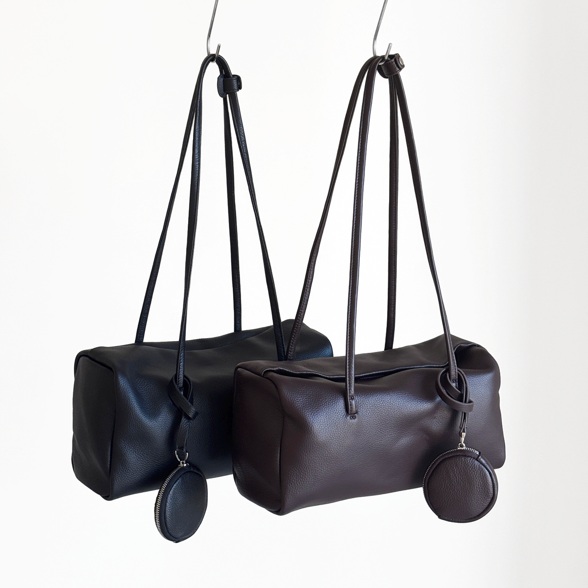Esme Smooth Shoulder Bag in Black and Dark Brown smooth cowhide, hanging overview
