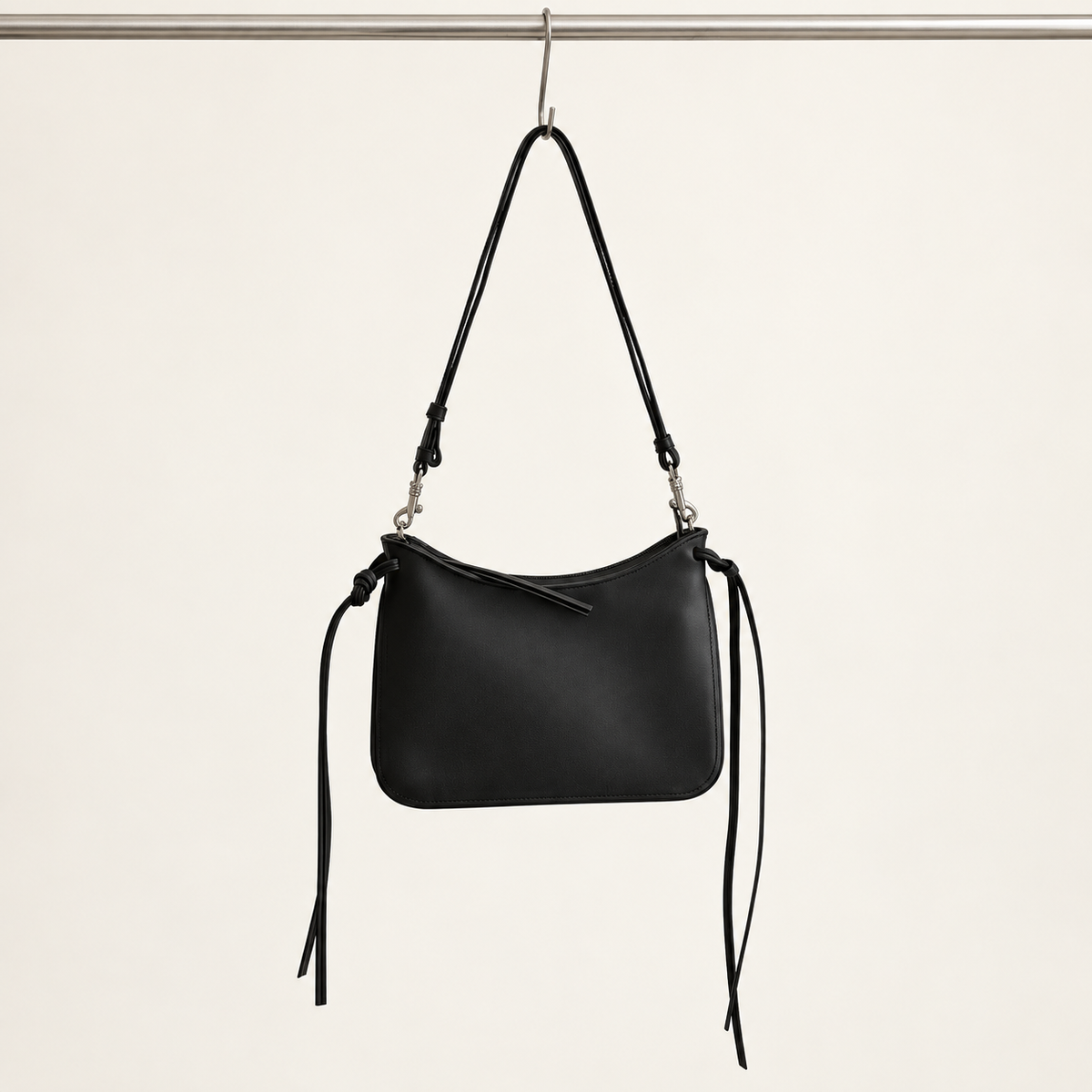 Noa Curve Shoulder Bag in Black, hanging view