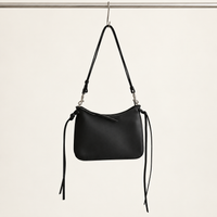 Noa Curve Shoulder Bag in Black, hanging view