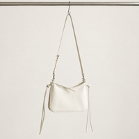Noa Curve Shoulder Bag in Ivory, hanging view