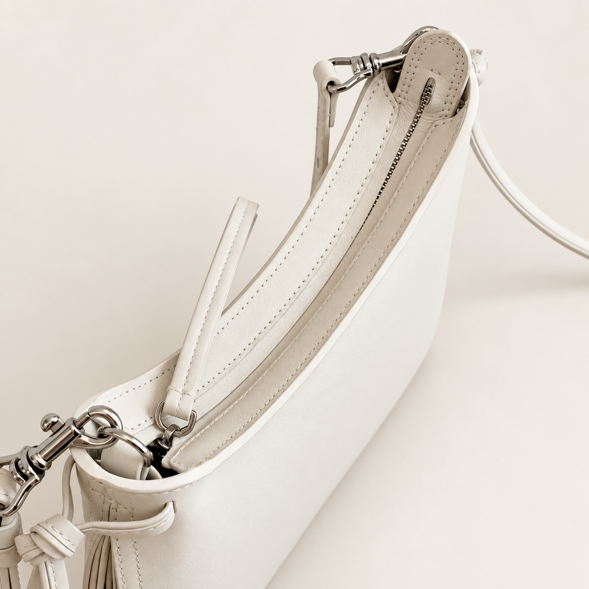 Noa Curve Shoulder Bag in Ivory, zipper and silver-tone hardware detail