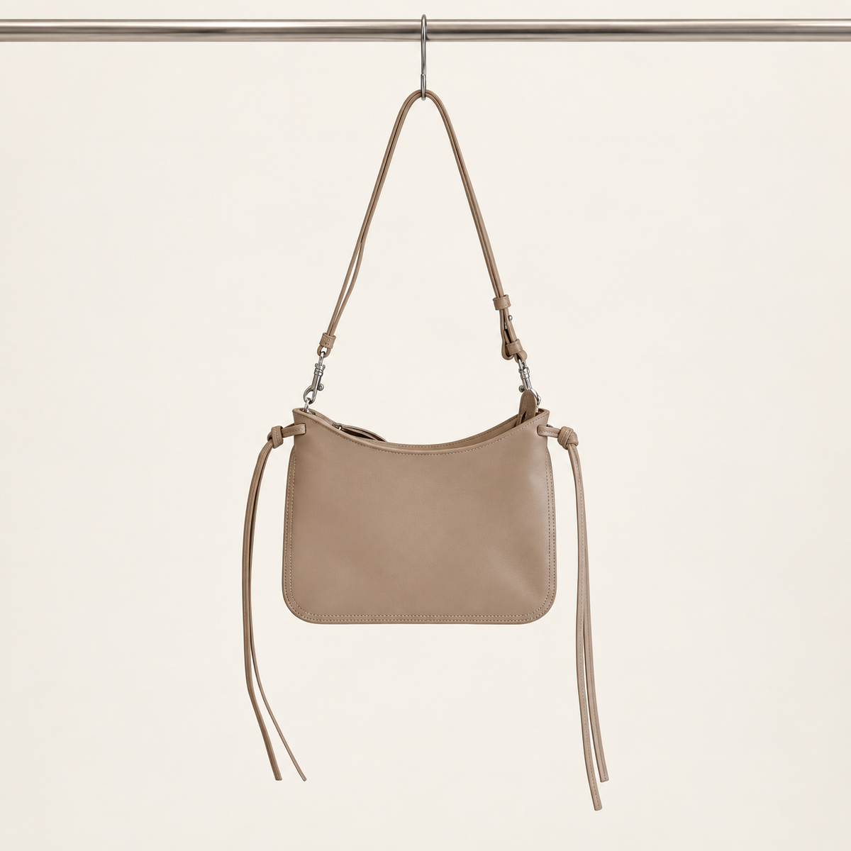 Noa Curve Shoulder Bag in Taupe, hanging view