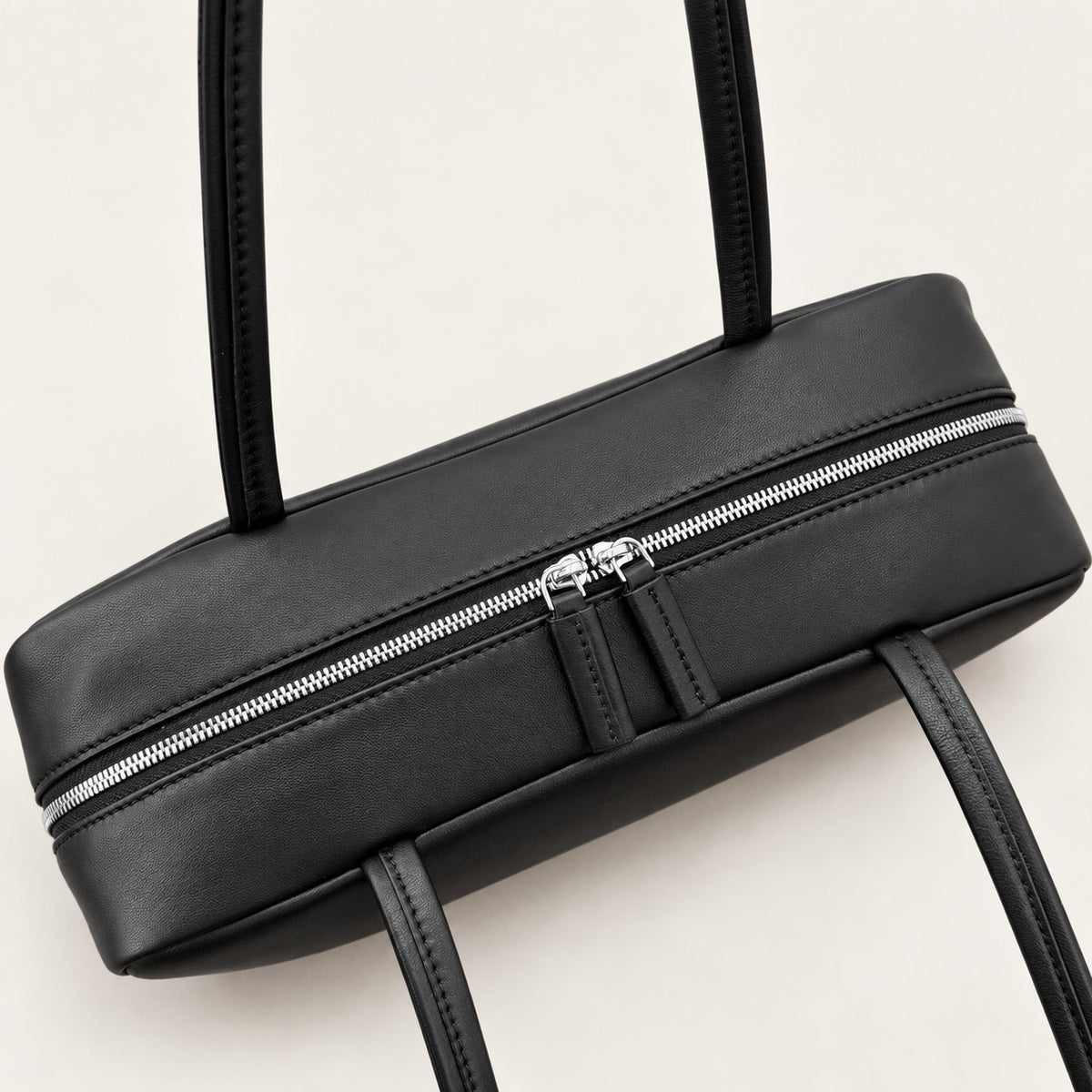 Nina Mini Bowling Bag in Black, two-way zipper detail