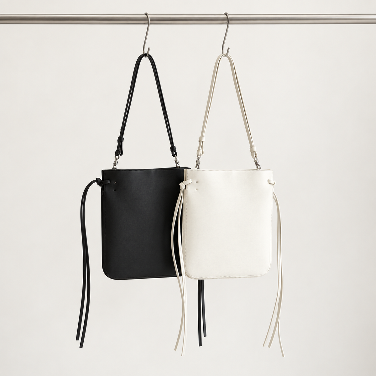 Tilda Tie Shoulder Bag in Black and Ivory, two colorways