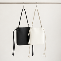 Tilda Tie Shoulder Bag in Black and Ivory, two colorways
