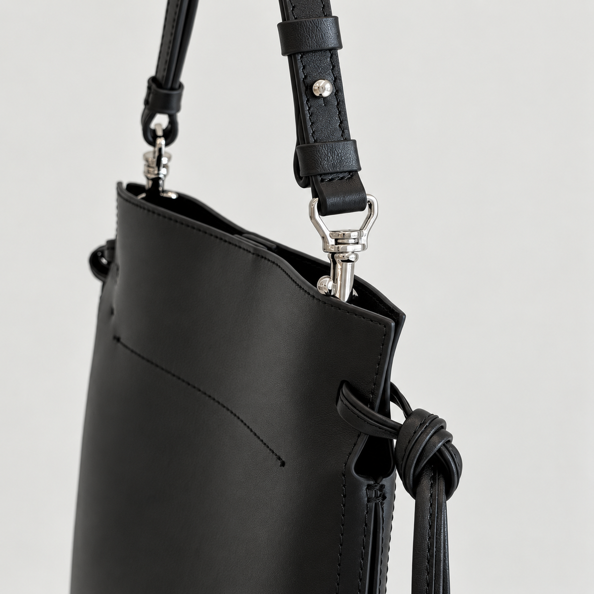 Tilda Tie Shoulder Bag in Black, side tie and silver-tone hardware detail