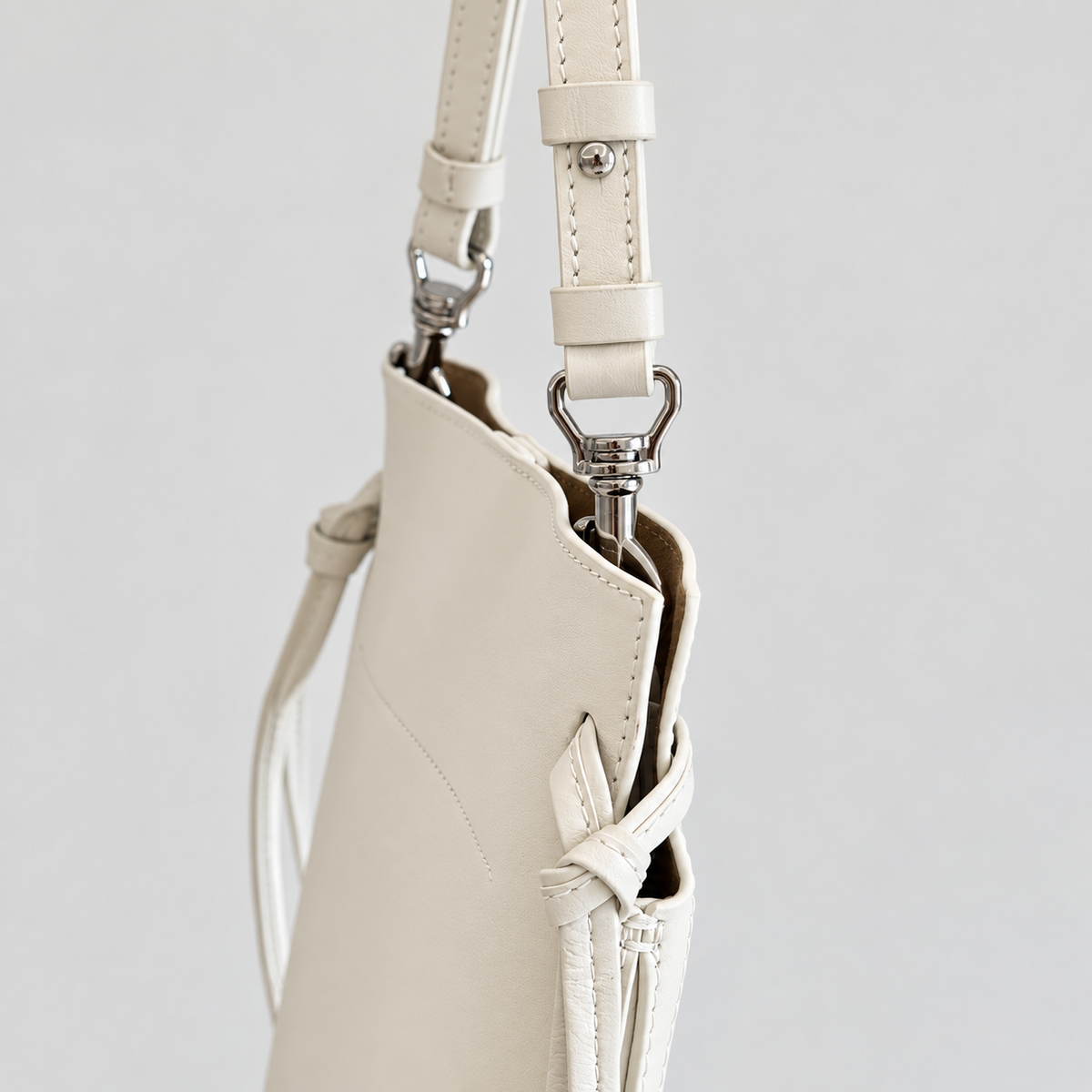 Tilda Tie Shoulder Bag in Ivory, side tie and silver-tone hardware detail