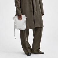 Tilda Tie Shoulder Bag in Ivory, carried on model