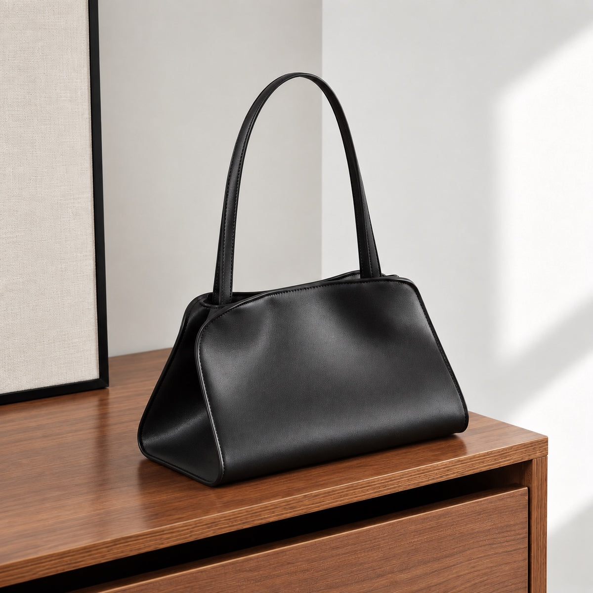 Odette Sculptural Shoulder Bag in Black, front three-quarter view