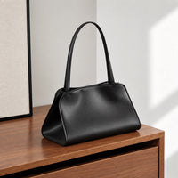 Odette Sculptural Shoulder Bag in Black, front three-quarter view