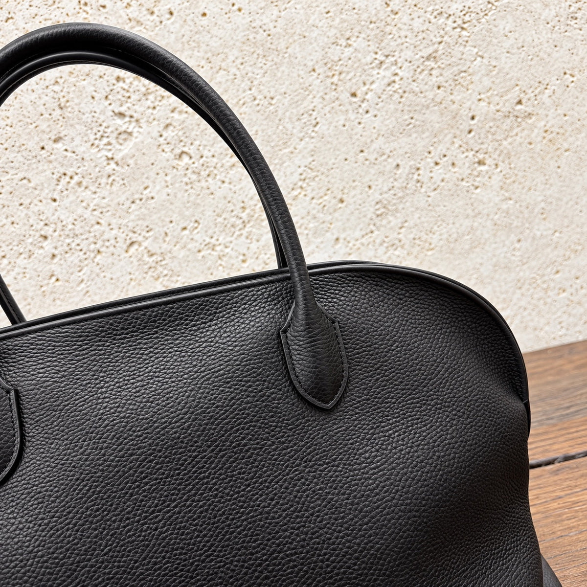 Black Agnes Bowling Bag, leather grain and handle detail