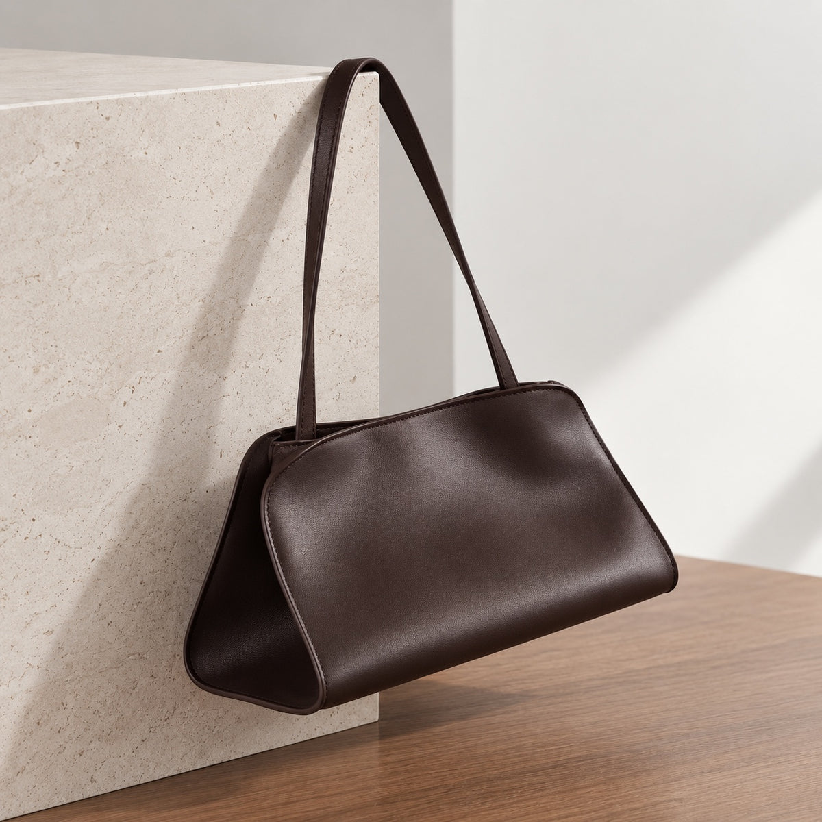 Odette Sculptural Shoulder Bag in Dark Brown, hanging side view