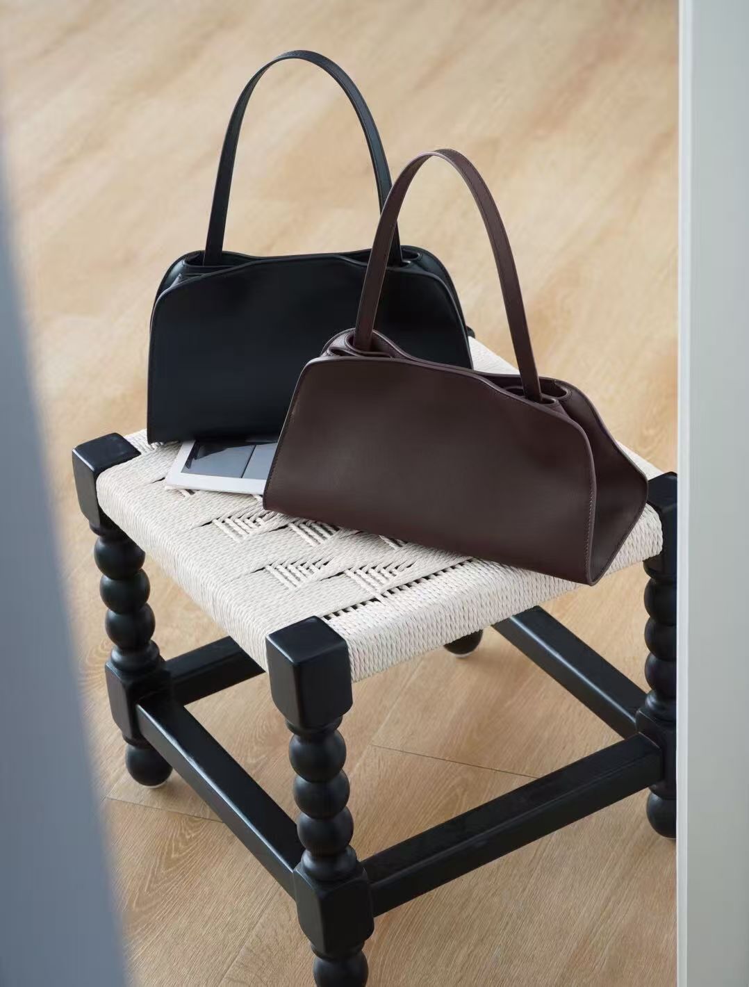 Black and deep brown Iona Rowe shoulder bags